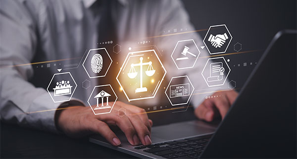 businessman using laptop with legal icons and symbols representing justice and law technology in a modern digital workspace eight important law concepts